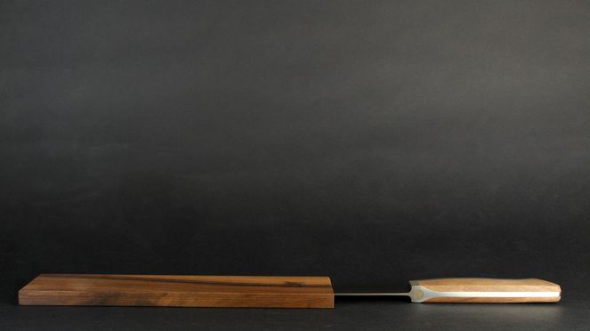 
                    The slicing knife Caminada with wooden sheath corresponds to the demands on quality of Andreas Caminada