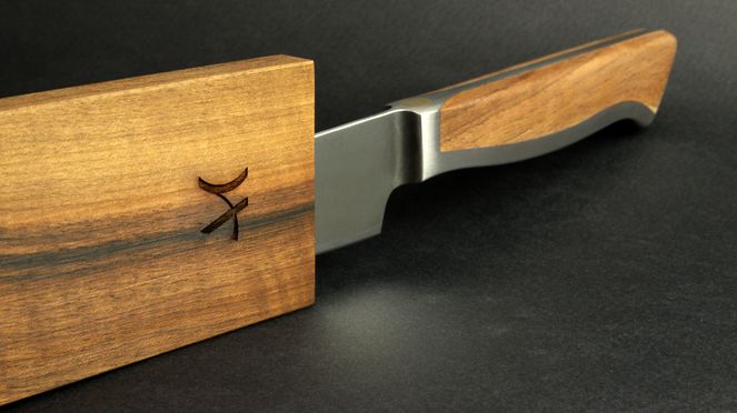 
                    slicing knife Caminada with wooden sheath created from collaboration of Andreas Caminada and the manufacture Güde in Solingen